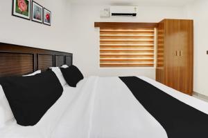 Letto o letti in una camera di Super Collection O Munnar