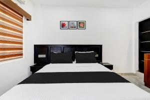 Letto o letti in una camera di Super Collection O Munnar