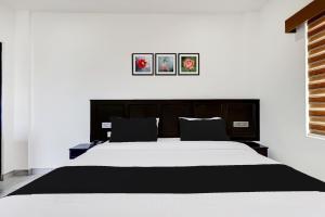 Letto o letti in una camera di Super Collection O Munnar