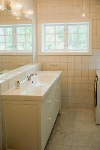 a bathroom with a sink and a window at Lake View Holiday Home With Natural Charm in Storfors