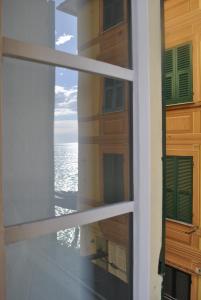 Фотография из галереи Al Piccolo Scoglio - Room & Breakfast в Камольи