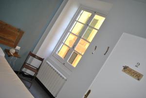 Кровать или кровати в номере Al Piccolo Scoglio - Room & Breakfast
