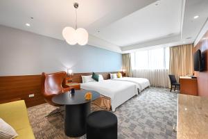 Rúm í herbergi á Via Hotel Breeze