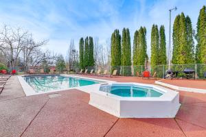 a swimming pool in the middle of a courtyard at Sauna, Pickleball Court and Game Room Sultan Villa! in Sultan