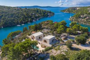 an aerial view of a house on a hill next to a river at NEW Villa Pine Haven , Private Heated Pool Sleeps 8, Tranquil Retreat in Bobovišća