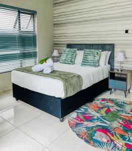 Ένα ή περισσότερα κρεβάτια σε δωμάτιο στο Q's Palace