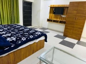 Postel nebo postele na pokoji v ubytování Hotel Golden Inn