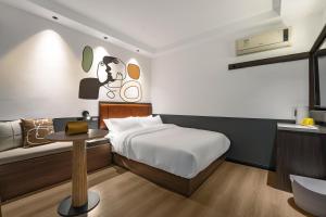Postel nebo postele na pokoji v ubytování Mcsrh Hotel-Changsha Yuanjialing