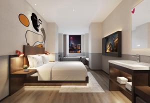 Postel nebo postele na pokoji v ubytování Mcsrh Hotel-Changsha Yuanjialing