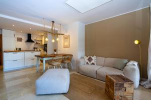 a living room with a couch and a table at Casa Vista Bonita in Port de Soller