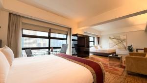 Postel nebo postele na pokoji v ubytování Hotel Maya Kuala Lumpur City Centre
