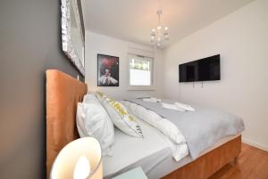 Posteľ alebo postele v izbe v ubytovaní MM Luxury Apartments GOLD & RUBIN