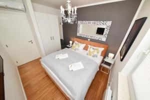 Posteľ alebo postele v izbe v ubytovaní MM Luxury Apartments GOLD & RUBIN