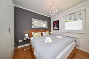 Posteľ alebo postele v izbe v ubytovaní MM Luxury Apartments GOLD & RUBIN