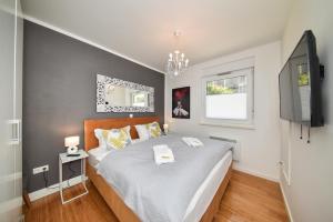Posteľ alebo postele v izbe v ubytovaní MM Luxury Apartments GOLD & RUBIN