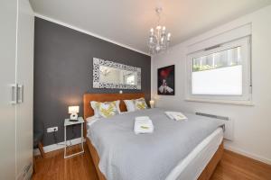 Posteľ alebo postele v izbe v ubytovaní MM Luxury Apartments GOLD & RUBIN