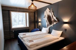 Postel nebo postele na pokoji v ubytování Hotel Metsähirvas