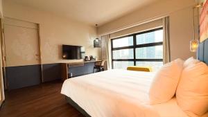 Postel nebo postele na pokoji v ubytování Hotel Maya Kuala Lumpur City Centre