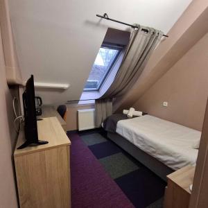 Postel nebo postele na pokoji v ubytování Hotel Unicornis