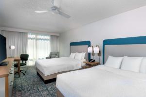 a hotel room with two beds and a desk at Homewood Suites by Hilton Tampa Airport - Westshore in Tampa +31 photos