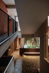 a view of the hallway of a building at Manon Boutique Hotel Kota Lama Semarang in Semarang