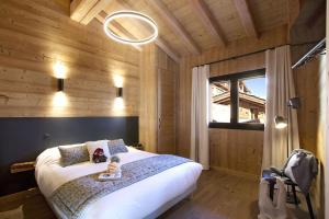 Ένα ή περισσότερα κρεβάτια σε δωμάτιο στο Odalys Chalet Le Télémark