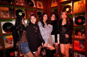 a group of women standing in a room with records at CLASSYC Hotel in Hanoi