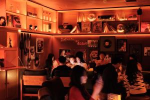 a group of people sitting in a restaurant at CLASSYC Hotel in Hanoi