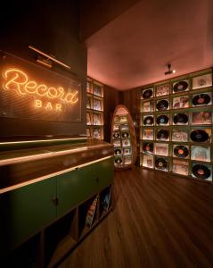 a restaurant with a bar with a skateboard on the wall at CLASSYC Hotel in Hanoi