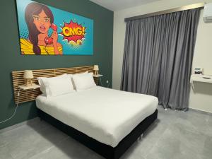 Ένα ή περισσότερα κρεβάτια σε δωμάτιο στο Connect Suites