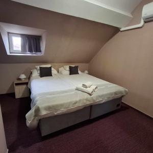 Postel nebo postele na pokoji v ubytování Hotel Unicornis