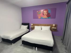 Ένα ή περισσότερα κρεβάτια σε δωμάτιο στο Connect Suites