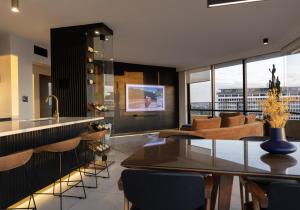 a kitchen and living room with a view of a building at Luxury Large 2 Bedroom Apartment Panoramic City Views! in Brisbane