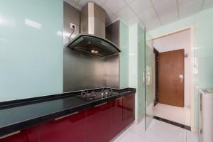 Cuina o zona de cuina de Sanya Zhi Ai Lily Seaview Apartment