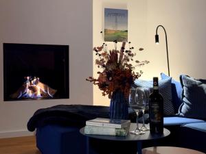 Posezení v ubytování Nordsee im Blick - Kamin & Privat-Garten - Design-Haus Heverstrom