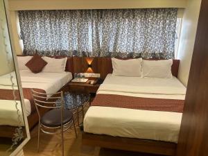 Postel nebo postele na pokoji v ubytování Hotel Abraj Inn
