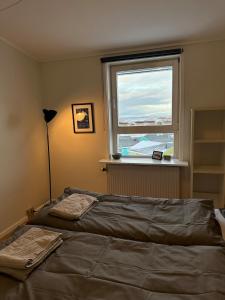 Postel nebo postele na pokoji v ubytování Illu Rental - Sea & City view Guesthouse
