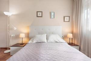 Ein Bett oder Betten in einem Zimmer der Unterkunft Acogedor estudio en Pedregalejo junto al mar