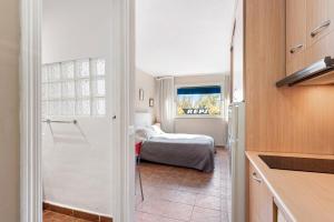 Ein Bett oder Betten in einem Zimmer der Unterkunft Acogedor estudio en Pedregalejo junto al mar