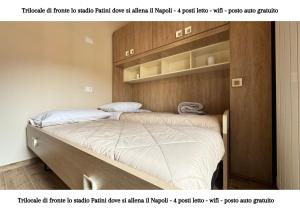 two twin beds in a bedroom with at CASTEL DI SANGRO - casa vacanza con wifi e posto auto vicino lo stadio in Castel di Sangro +11 photos