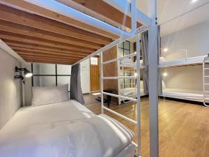 En eller flere senger på et rom på Mini Voyage Hostel