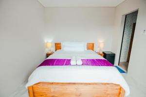Ένα ή περισσότερα κρεβάτια σε δωμάτιο στο Turtle Shelter Guest House +43 φωτογραφίες