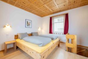 Postel nebo postele na pokoji v ubytování Garni Alpenrose - Grusaida