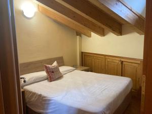 Letto o letti in una camera di Residence Dei Walser