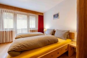 Postel nebo postele na pokoji v ubytování Garni Alpenrose - Grusaida