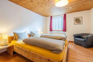 Postel nebo postele na pokoji v ubytování Garni Alpenrose - Grusaida
