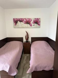 Ένα ή περισσότερα κρεβάτια σε δωμάτιο στο Apartments Tomas II
