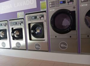 a row of washing machines on display in a store at Madrid Modern Apartment in Madrid