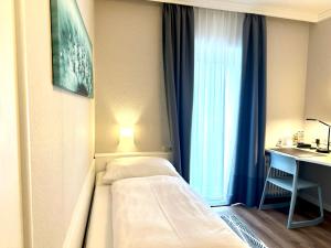 Postel nebo postele na pokoji v ubytování Hotel Villa Solln