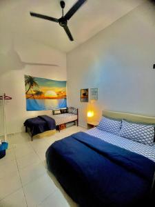 a bedroom with a blue bed and a ceiling fan at Vintage Houze, fully aircond, Wi-fi, Netflix, Coway in Alor Setar